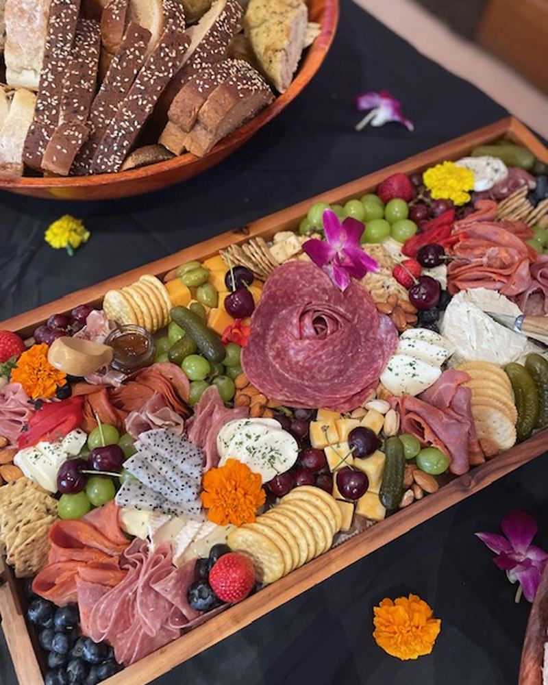Event grazing table with charcuterie and flowers