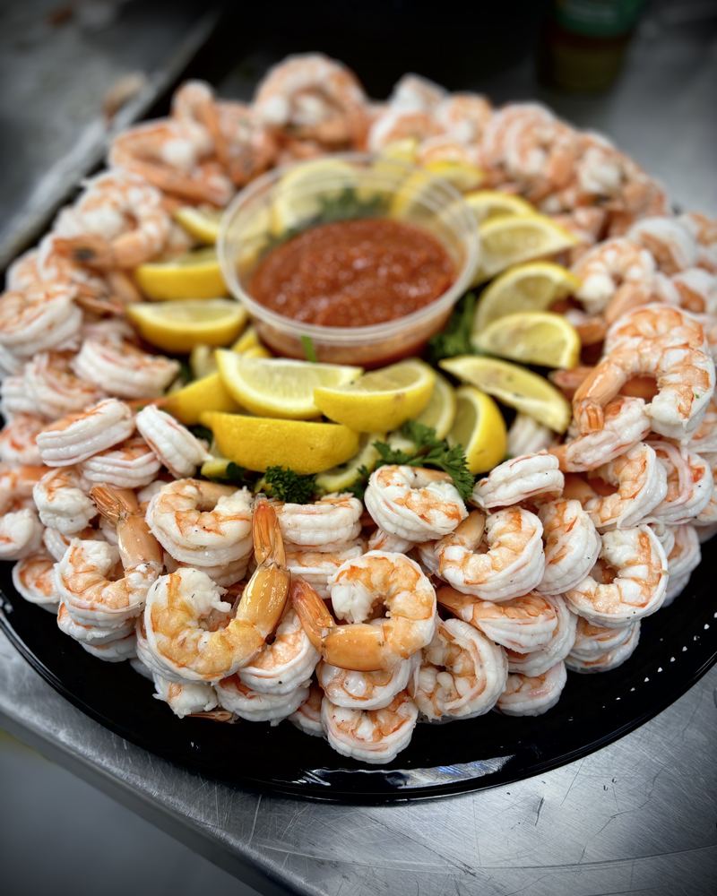Shrimp cocktail platter with lemon and cocktail sauce