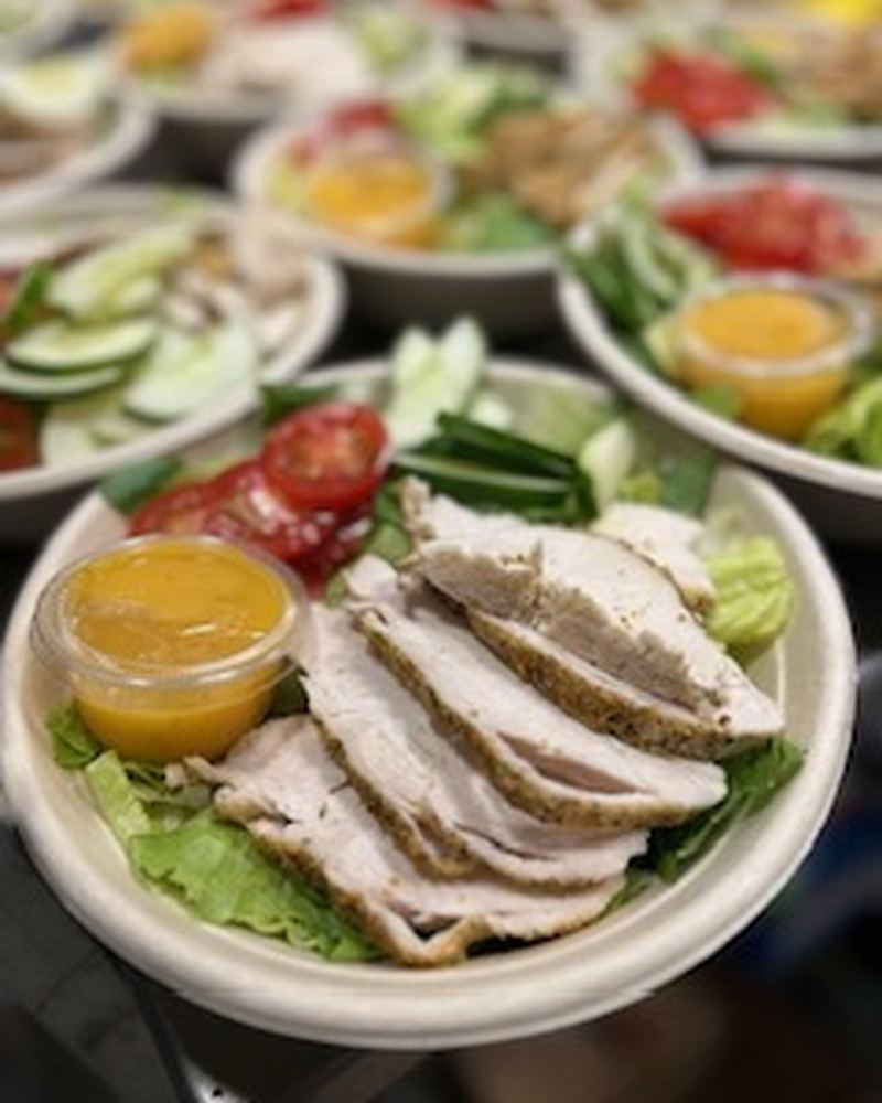 Grilled chicken salads with dressing on the side