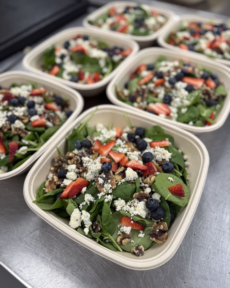 Individual spinach salads with berries and feta