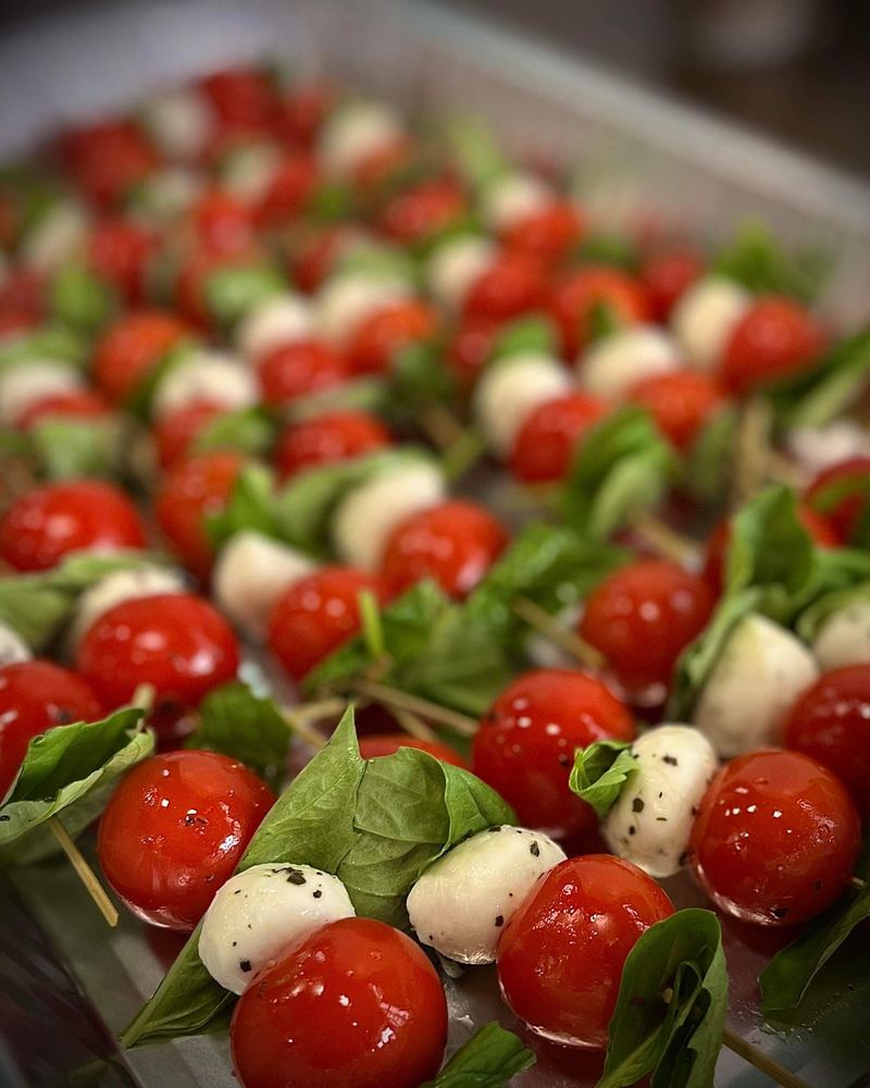 Caprese skewers with cherry tomatoes, mozzarella and basil