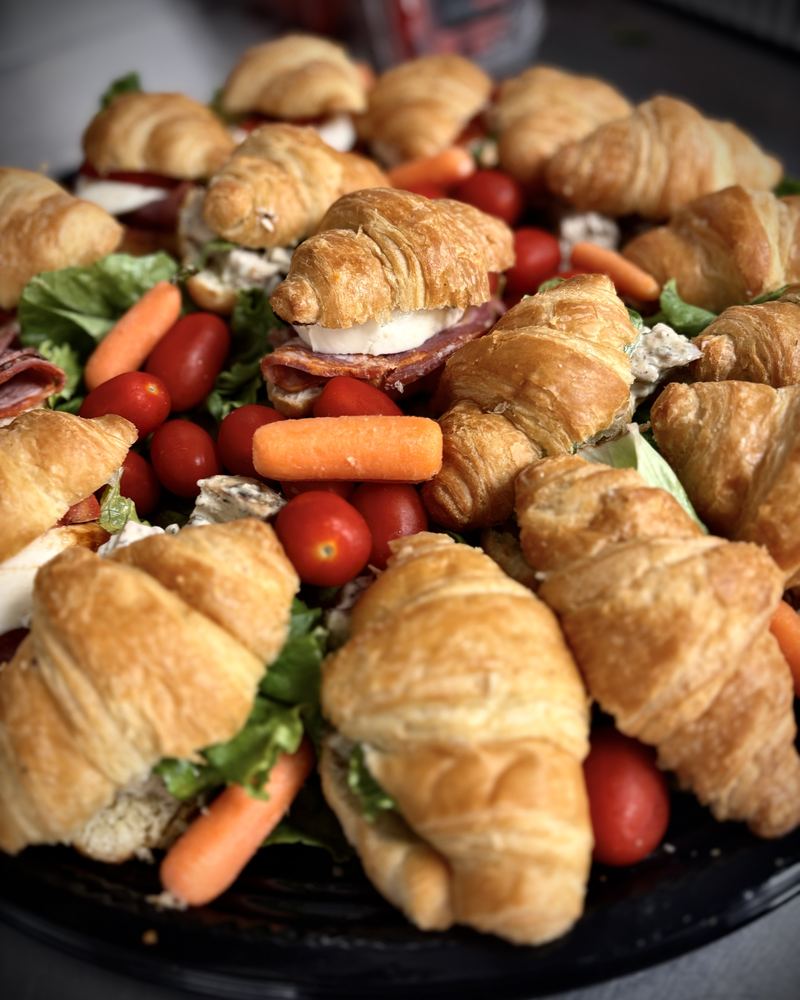 Croissant sandwich platter with carrots and cherry tomatoes