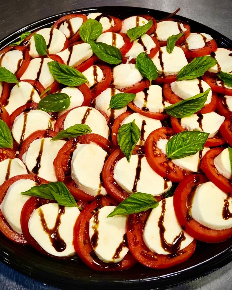 Caprese salad platter with balsamic glaze
