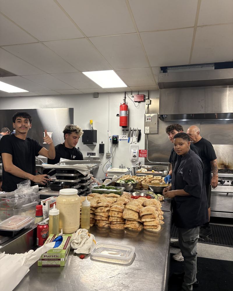 The Feast Mode kitchen team preparing a catering order