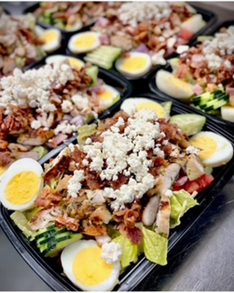 Cobb salads with egg, bacon and blue cheese