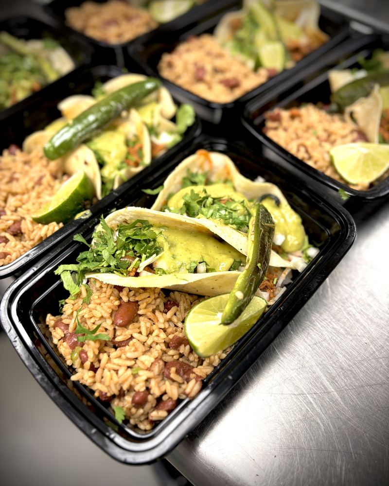 Boxed rice bowls with avocado