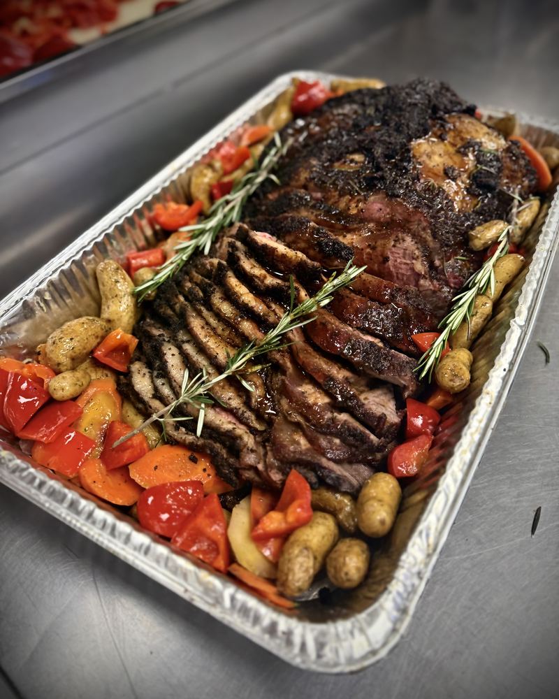 Roast beef tray with roasted potatoes and tomatoes