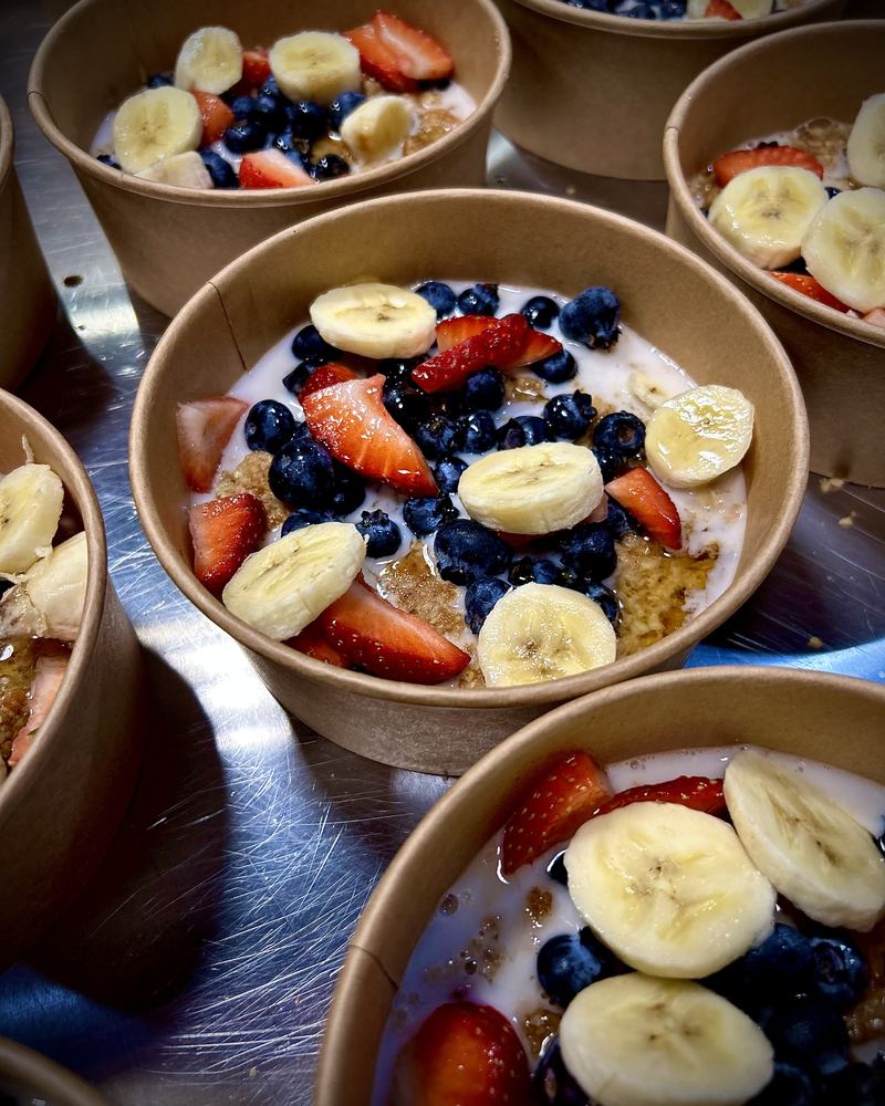 Yogurt bowls with banana, strawberries and blueberries