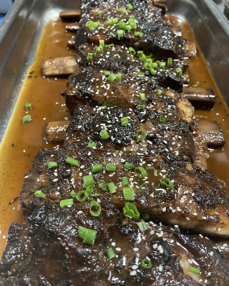 Braised short ribs topped with scallions